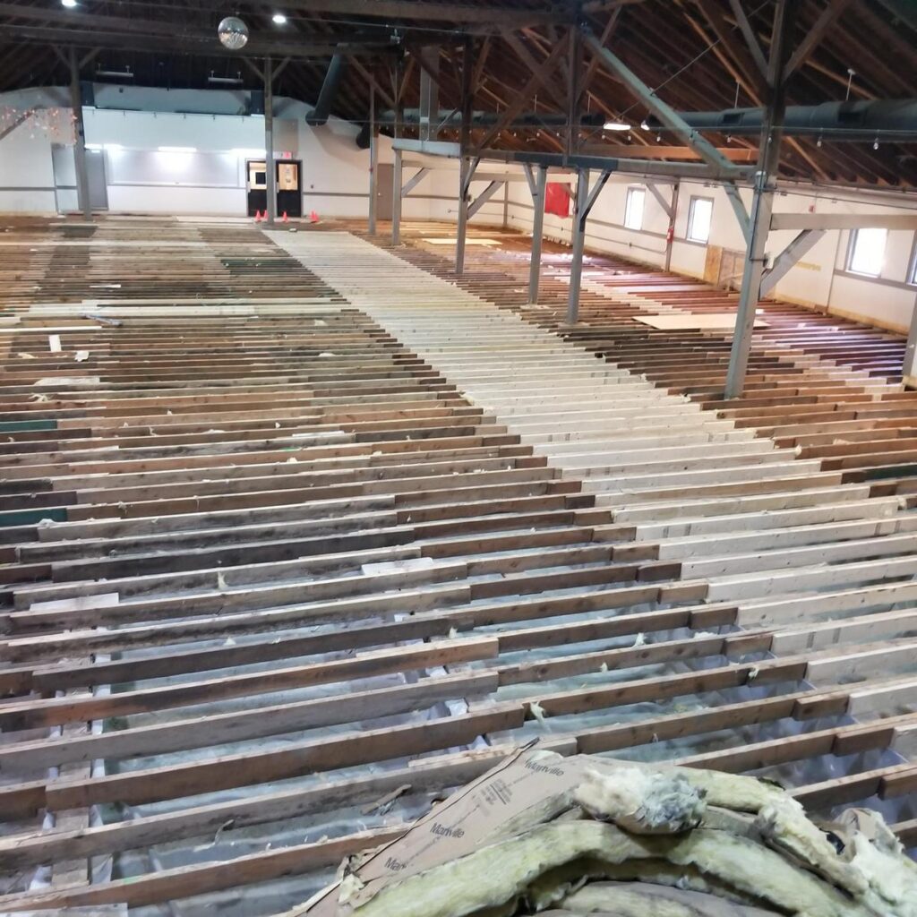 Replacing floor joists as part of structural repairs of the Bush Tabernacle Purcellville Roller Rink.