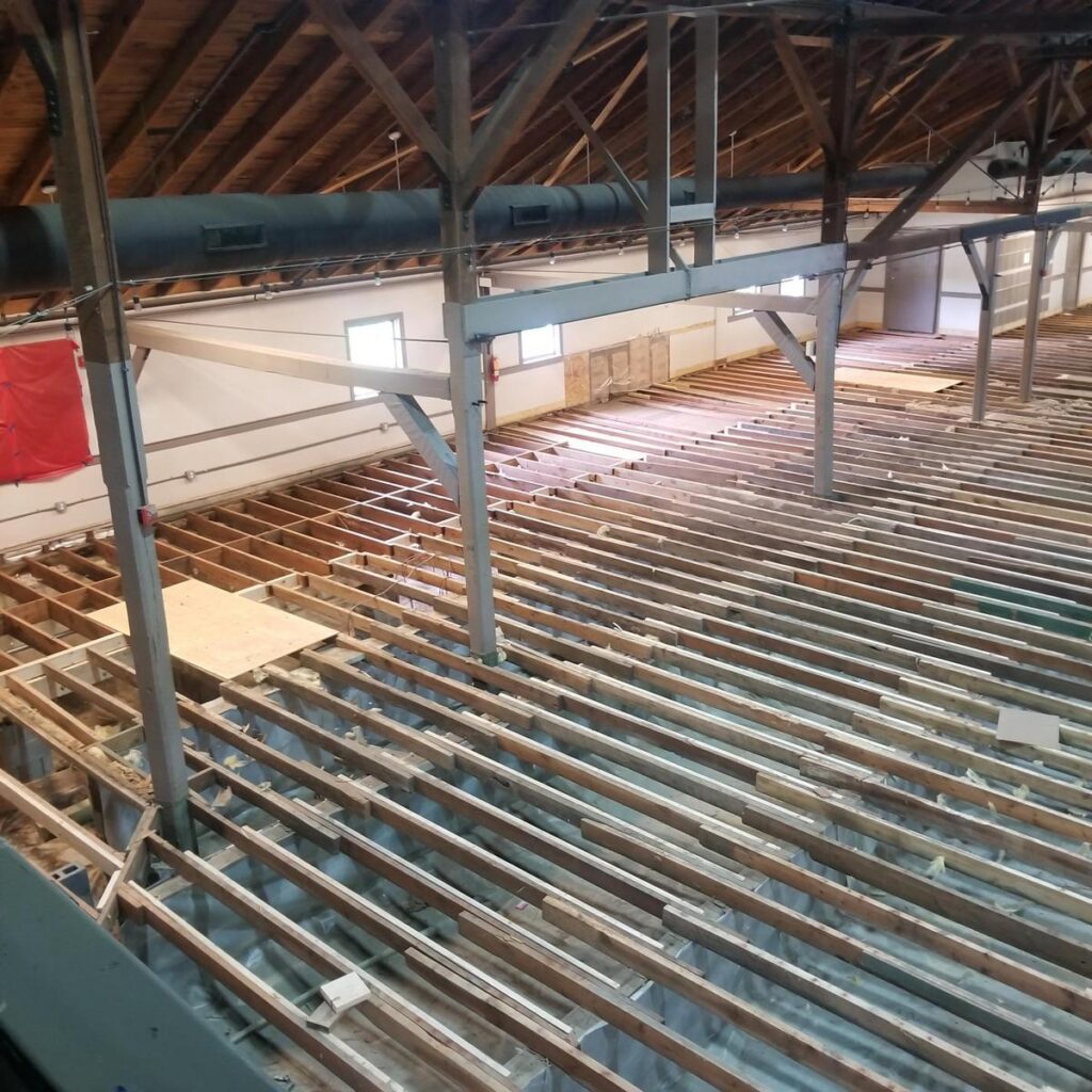 Sub-flooring at Purcellville Roller Rink after structural repairs by Oak Ridge Commercial Construction.