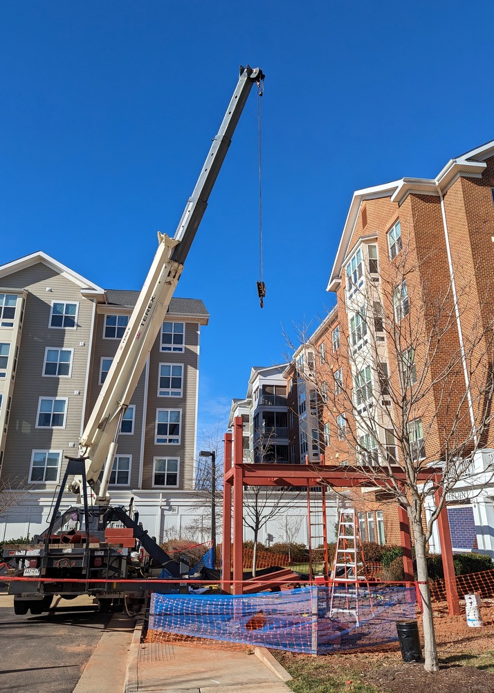 Erecting steel for canopy at Ashby-Ponds