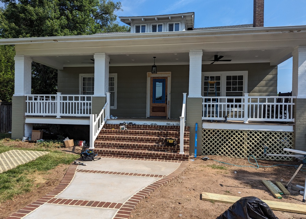 Elden Street front porch floor and railings in place. Columns completed.