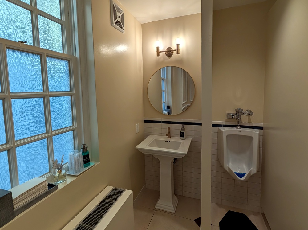 Capitol Hill Club renovation to men's bathroom tile, cabinets, countertops and plumbing fixtures